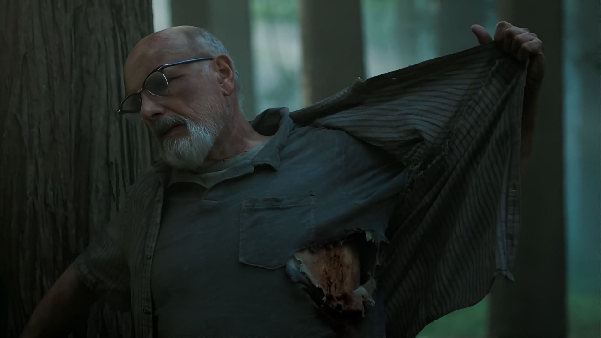 Eugene reveals his bite wound to Joel and Ellie, knowing what comes next. (Image via Hulu)